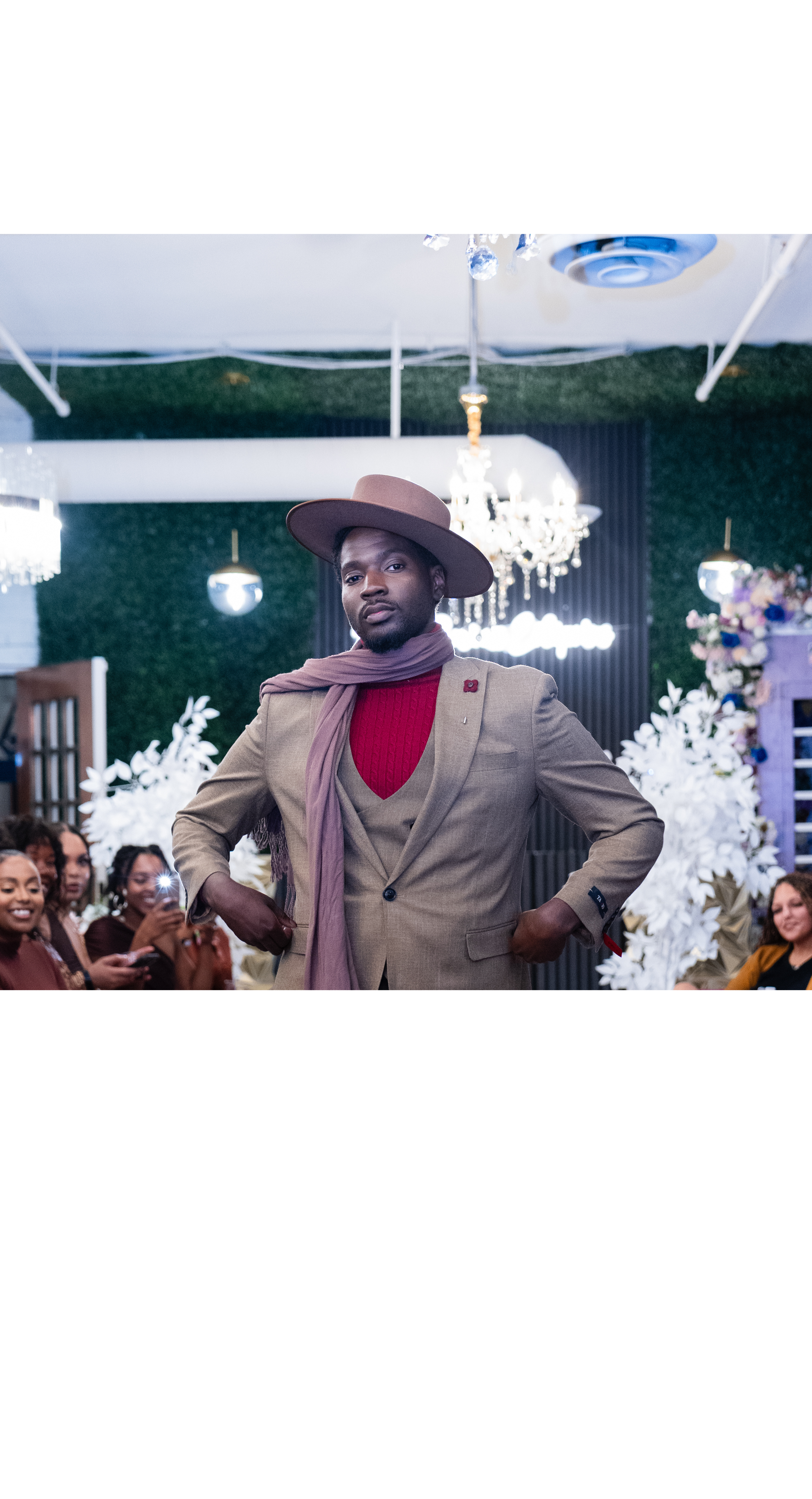 A model in elevated brown attire on the 2025 runway